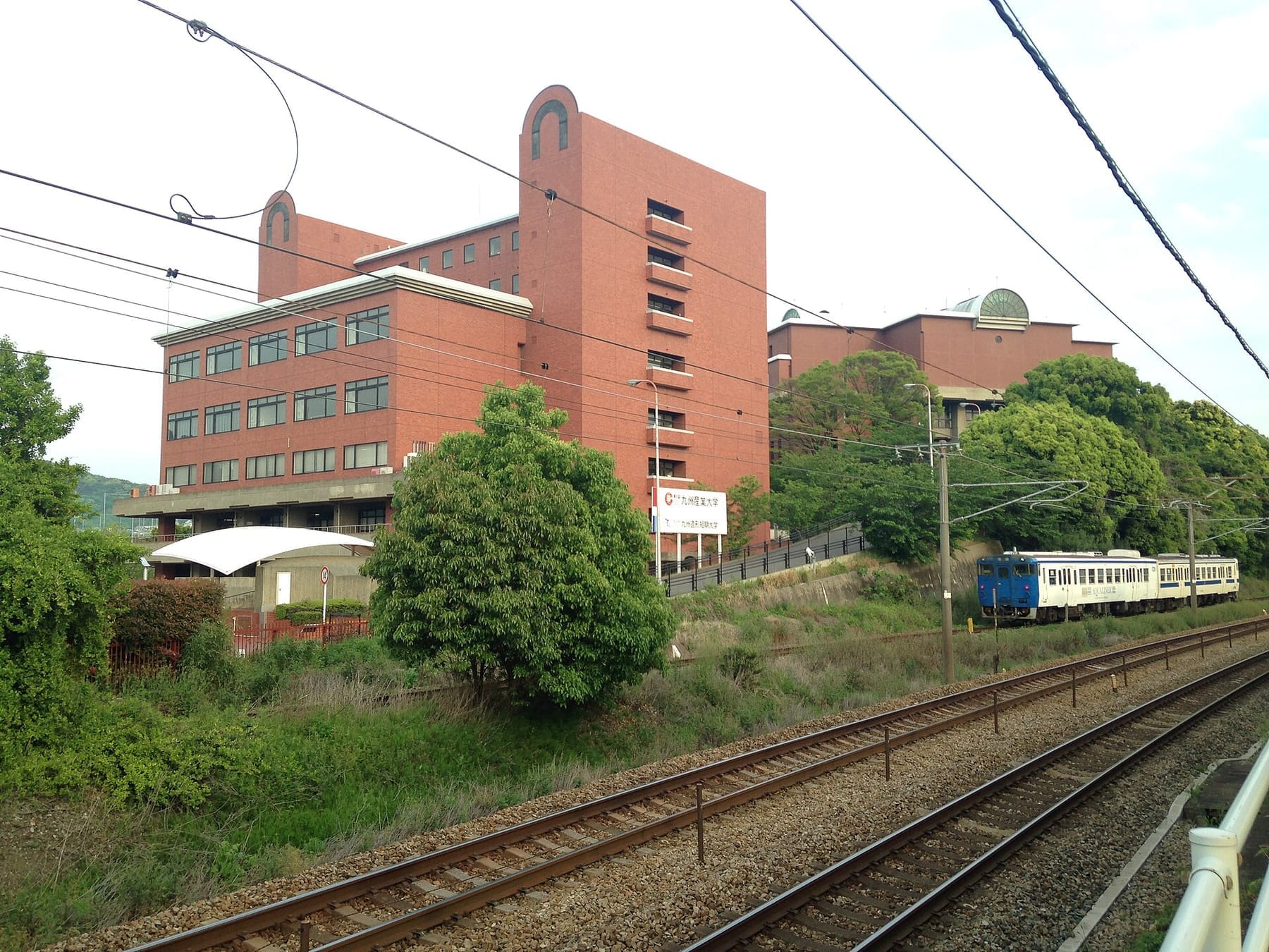 Buildings of Kyushu Industrial University and Aqualiner (photograph from the Wikimedia Commons category Kyushu Sangyo University)